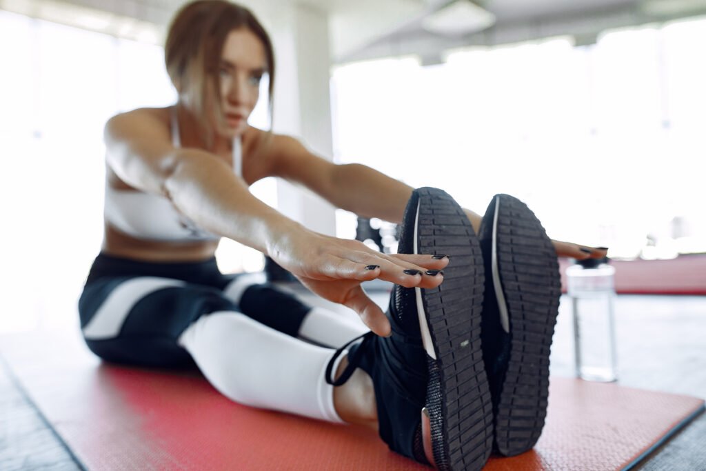 Sports girl training in a morning gym